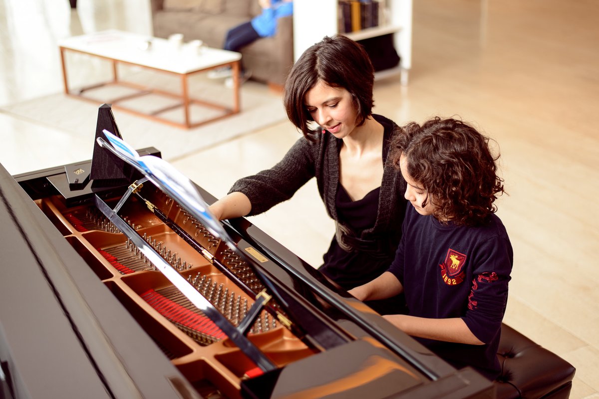 Natasha Finlay teaching a child piano in Toronto